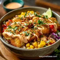 The Cracking Air Fryer Fish Taco Bowls with Zesty Chipotle Crema
